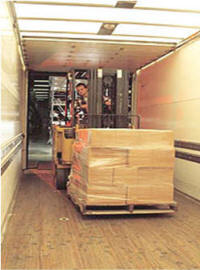 loading skids and pallets on truck trailer 