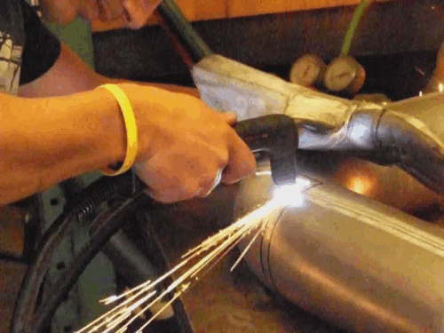 animation of welder welding exhaust pipes