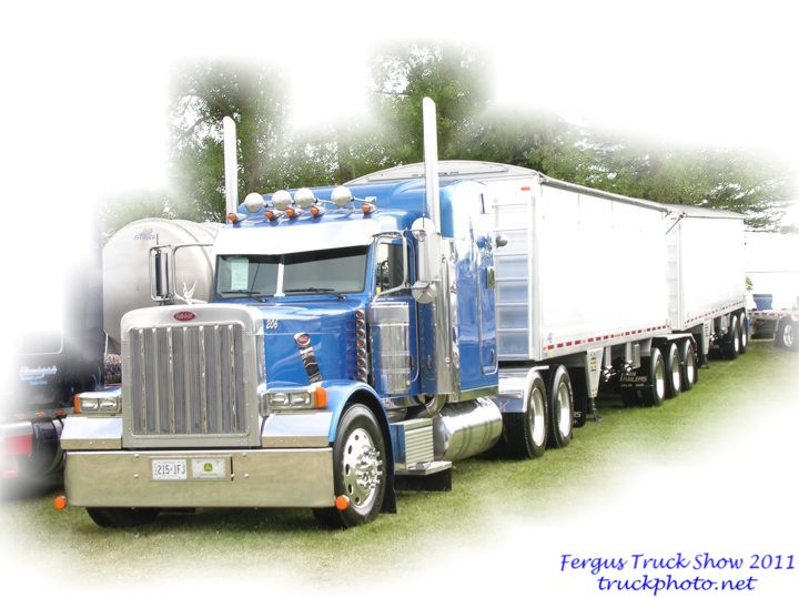 Blue Peterbilt Pulling Grain Train