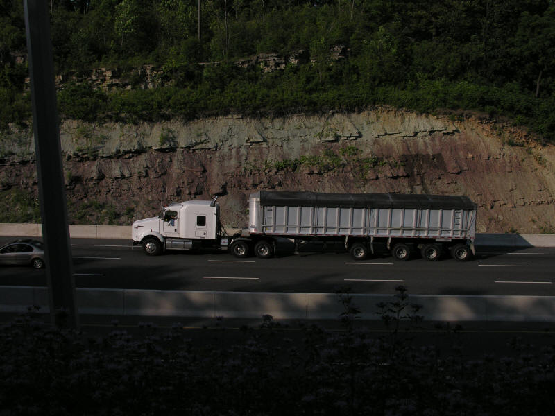 Kenworth highway unit with covered wagon working on the heavy haul climbing Clappison Hill