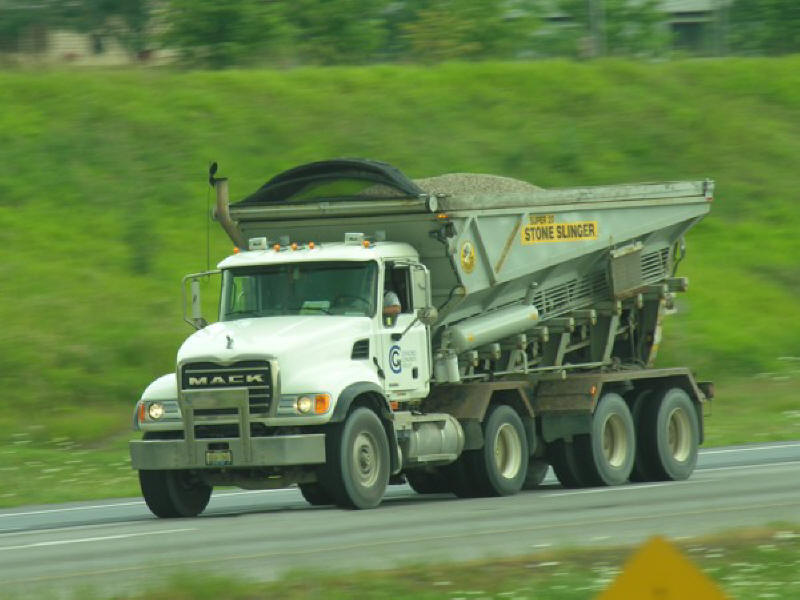 Picture of Mack Truck Stone Slinger driving along the highway