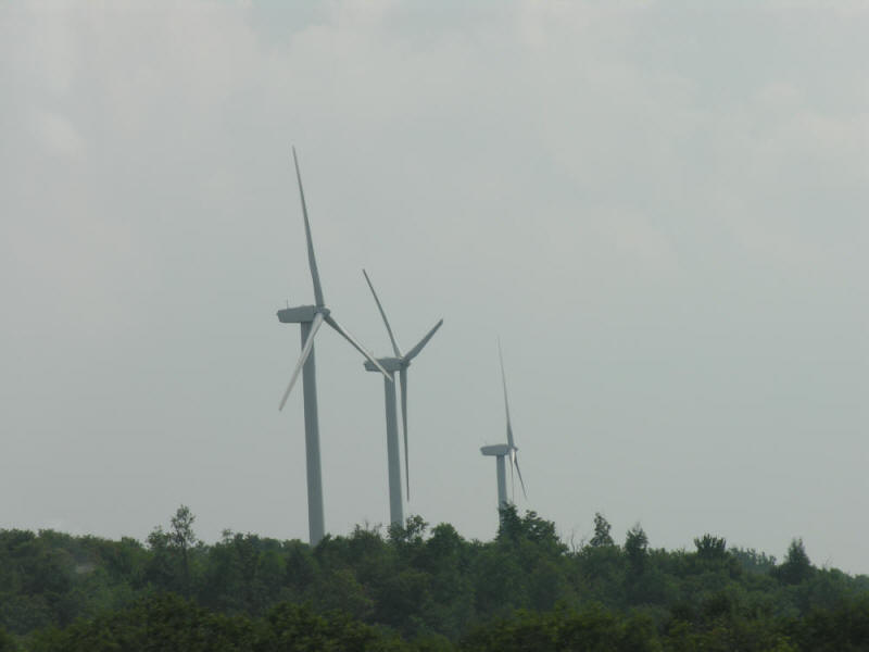 Wind turbines on a hill in a row in Upstate New York.